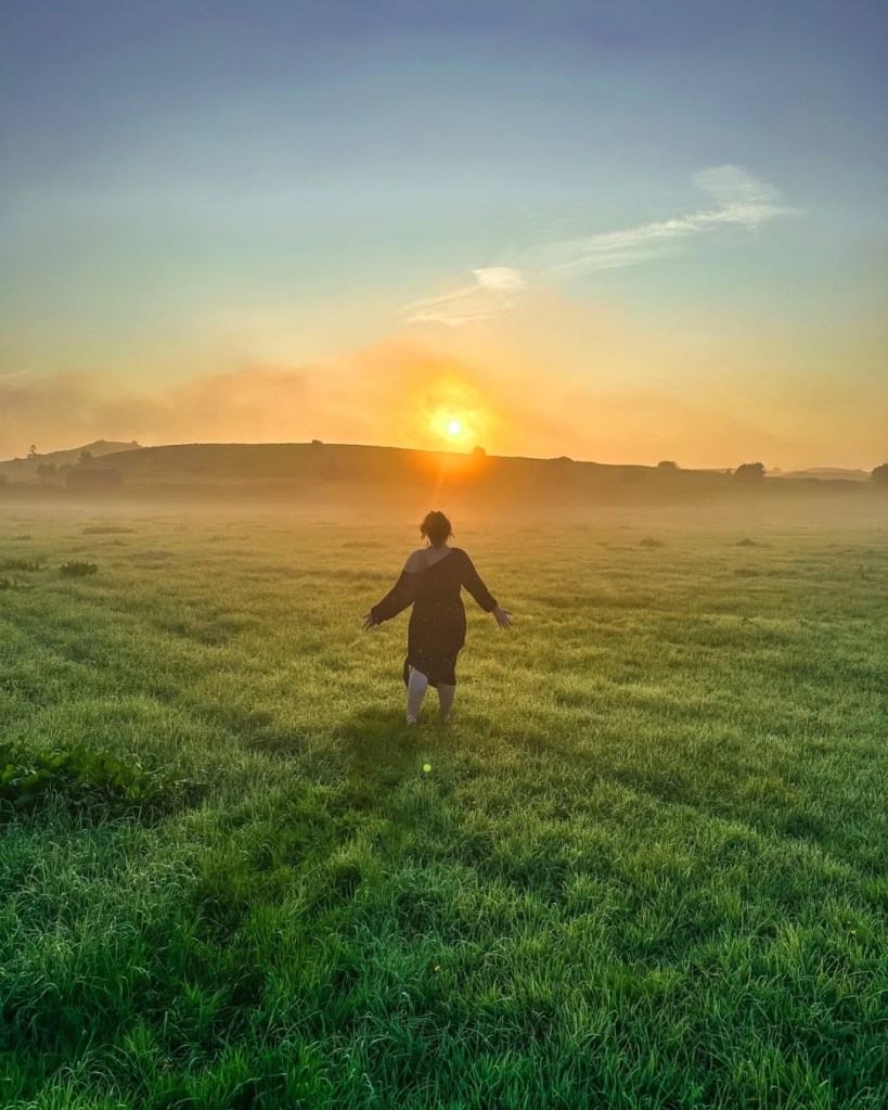 heather canfield run woman grass field sun sunset sunrise blue sky nature Ireland