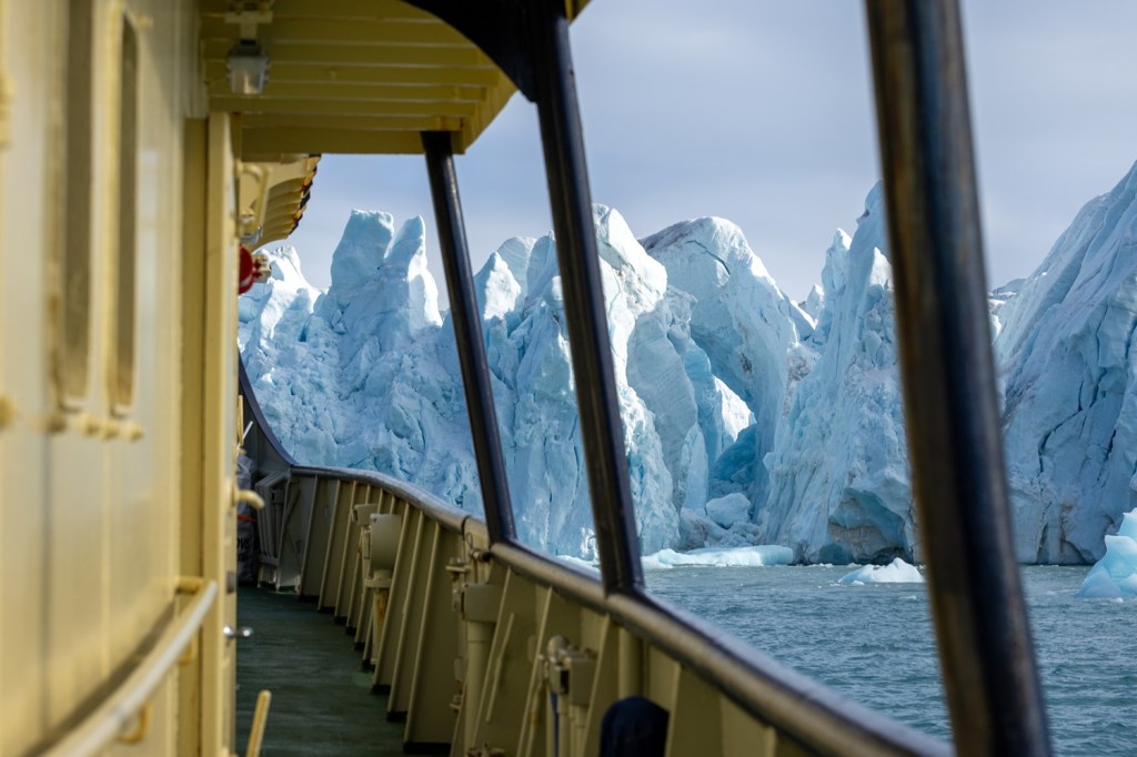 glacier ship boat deck ice climate change travel journey water tourism polar arctic sail